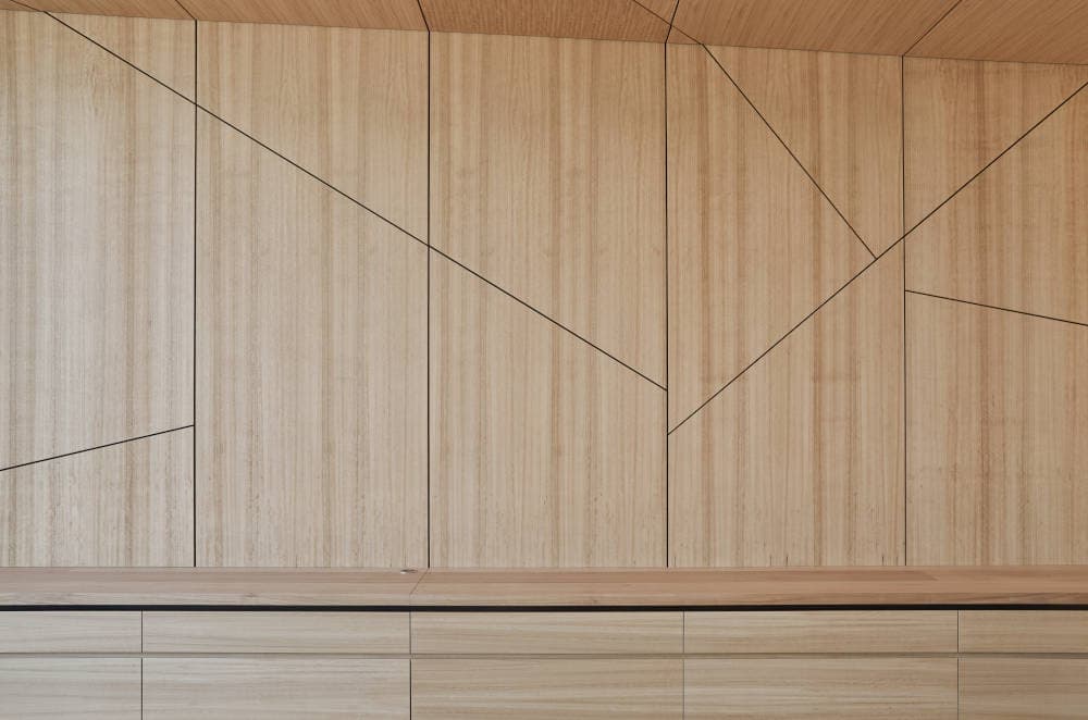 Finished complex geometry wall panel with clean angular seams